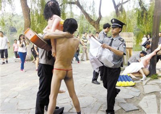 Illustration for article titled Protesting Piracy in China with...Blow-Up Dolls